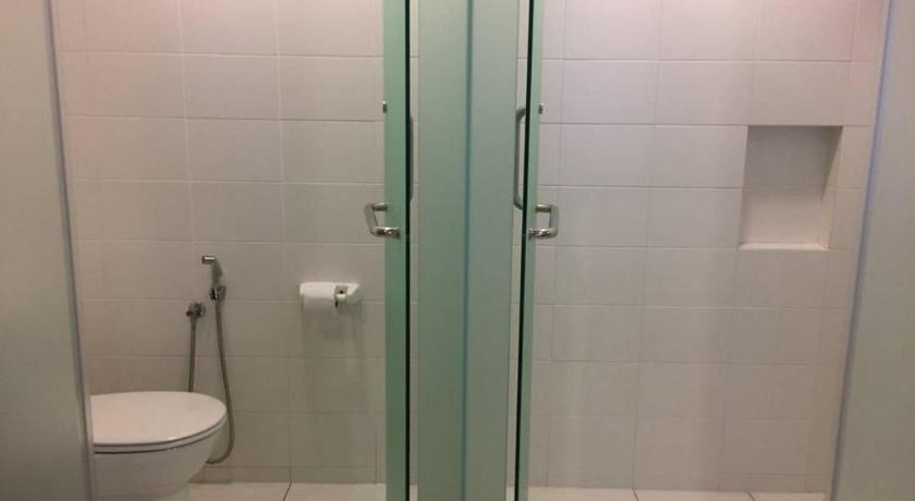 a bathroom with a toilet and a shower stall, 34 Studio at Trefoil Setia Alam in Shah Alam