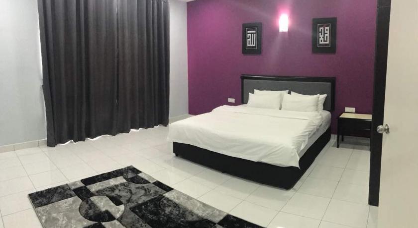 a bed room with a white bedspread and a blue wall, ARA Muslim House @ Mutiara Heights Johor Bahru in Johor Bahru