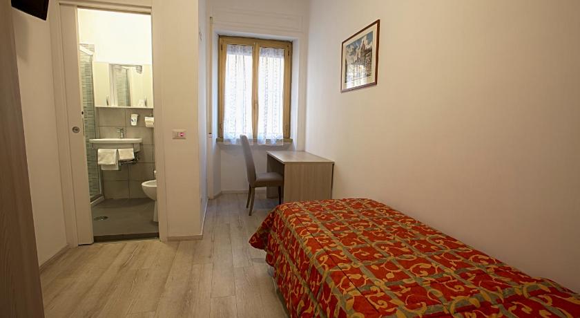 a room with a bed and a window, Adriatic Hotel in Rome