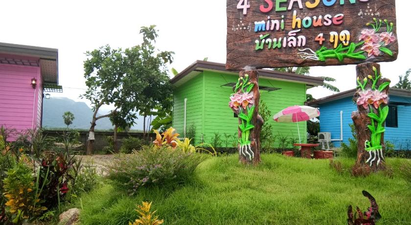 a sign that is on the side of a building, 4 seasons mini house in Nakhon Si Thammarat