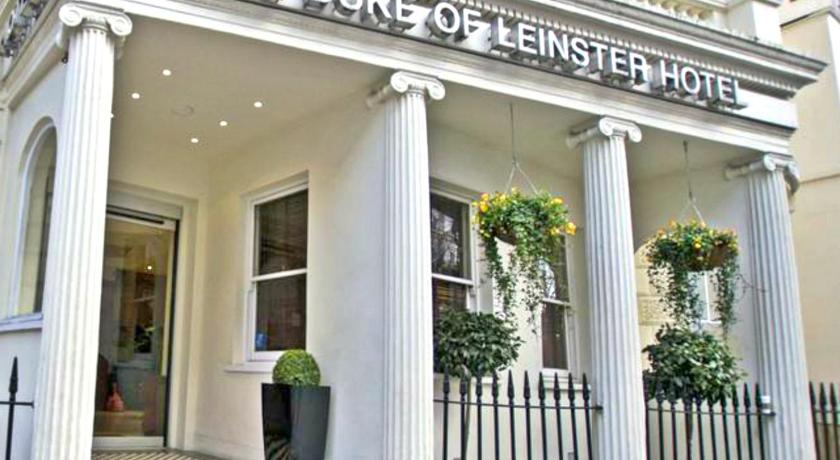 a white building with a sign on the front of it, Duke of Leinster Hotel in London