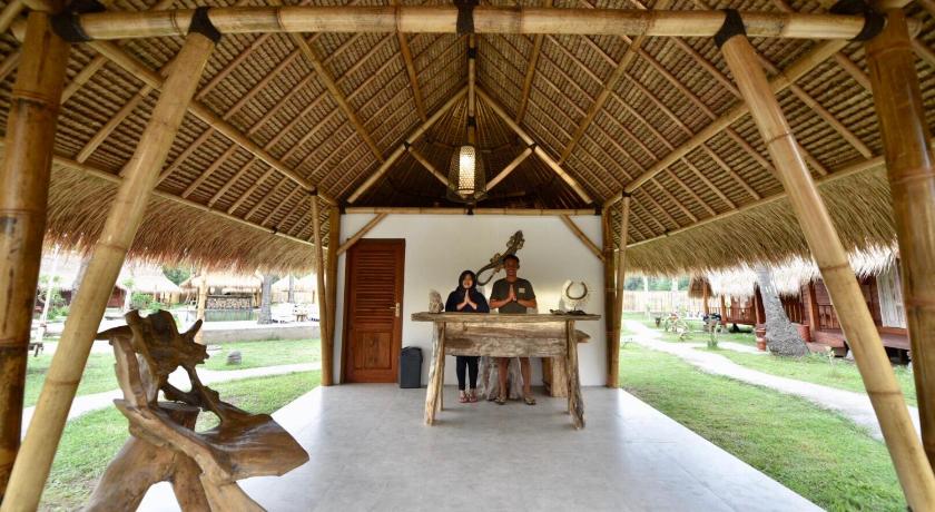 a room with a table, chairs and a tent, Beranda Ecolodge in Lombok
