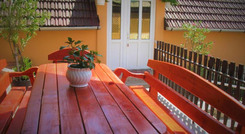 a wooden bench sitting in front of a patio, Bihari Vendeghaz in Felsotarkany