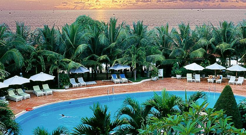 a beach with palm trees and palm trees, Saigon Phu Quoc Resort and Spa in Phu Quoc Island