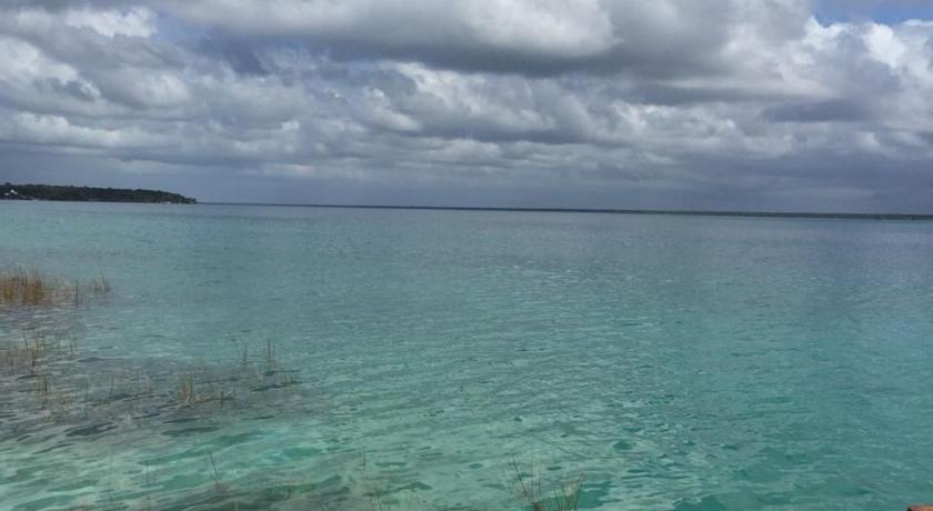 a large body of water with a blue sky, El Roble Nature Hotel & Lagoon in Bacalar