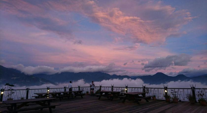 a man standing on top of a wooden pier looking at the water, Nalu Wan Villa in Nantou