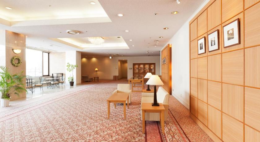 a living room filled with furniture and a large window, Hotel Grand Terrace Obihiro in Tokachi