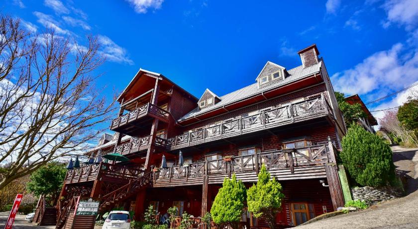 a large building with a clock on the side of it, Beverly B&B in Nantou