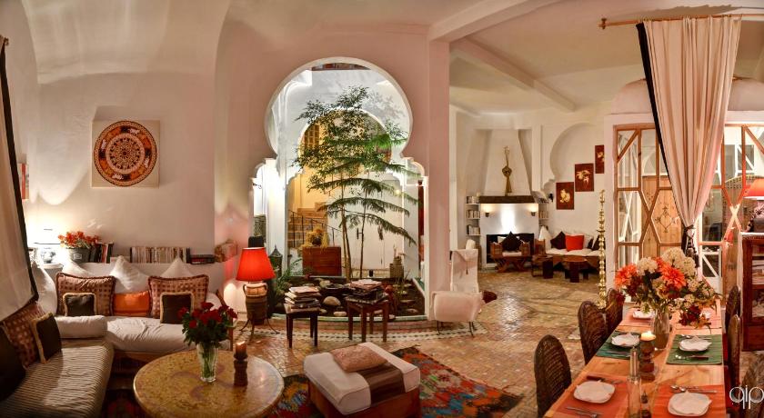 a living room filled with furniture and decorations, Dar Liouba Hotel in Essaouira