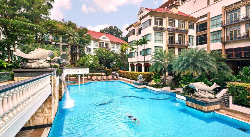 a large swimming pool with a large balcony, Treetops Executive Residences in Singapore