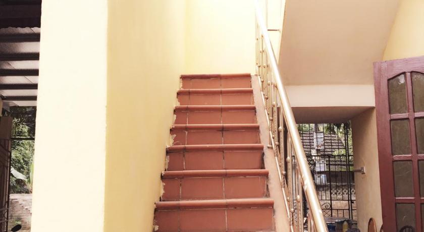 a row of stairs leading up to a balcony, Mai's homestay in Ninh Bình