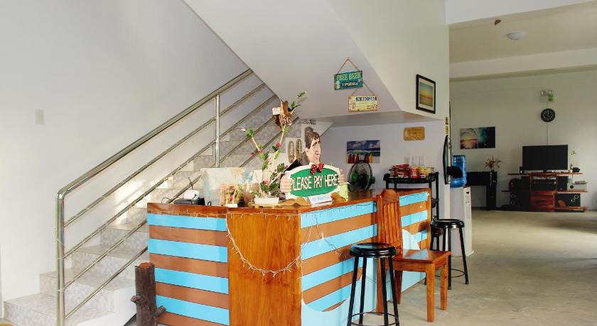 a kitchen filled with furniture and a counter top, Chickie's Seaside Place in Pandan