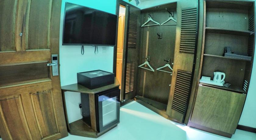 a kitchen with a sink, microwave, and cabinets, Six In One in Male City and Airport