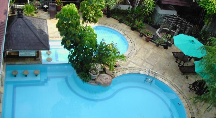 a patio with a pool and a pool table, Resor Tuban Tropis in Tuban