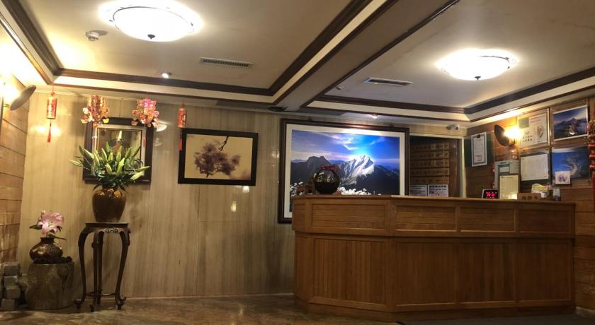 a large room with a large window and a large clock on the wall, Chinshan Hotel in Chiayi