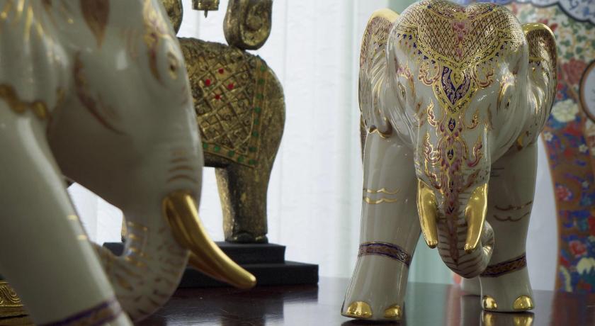 elephant statues are displayed in a room, PTK Residence in Koh Samui