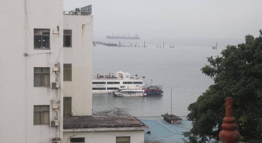 a large cruise ship docked at a harbor, Hoang Yen Hotel in Hạ Long