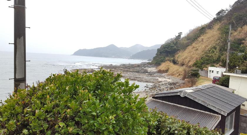 a house on the edge of a beach near a body of water, Private House Minshuku Tateishi A in Shimonoseki