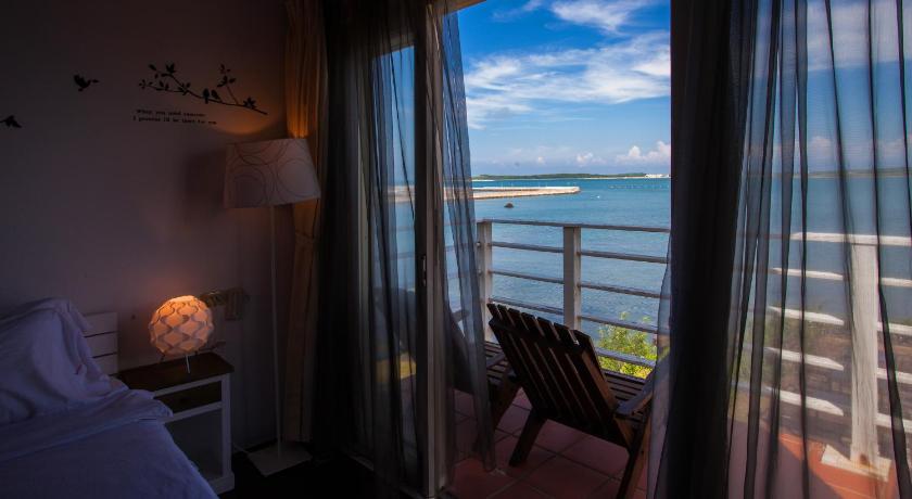 a hotel room with a view of the ocean, Summer Ya BnB in Penghu
