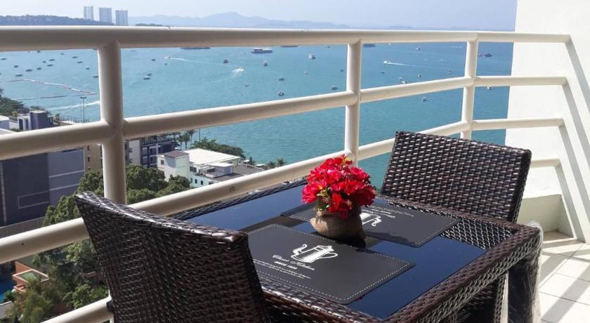 a table with a chair and a table cloth on top of it, View talay 6 Mark in Pattaya