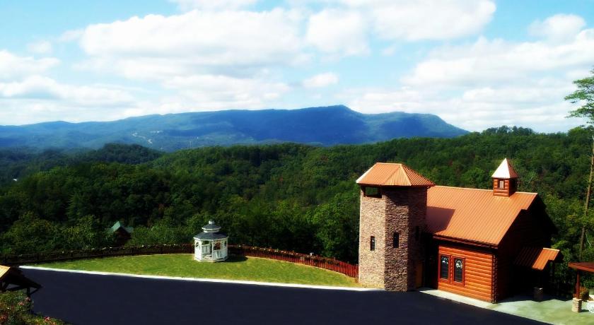 a house with a clock tower on top of it, Hartman Hideaway Economy Cabin in Pigeon Forge (TN)