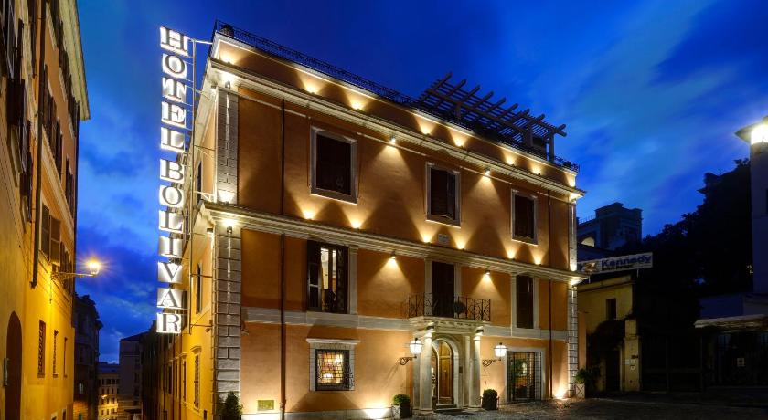 a large building with a clock on the front of it, Comfort Hotel Bolivar in Rome