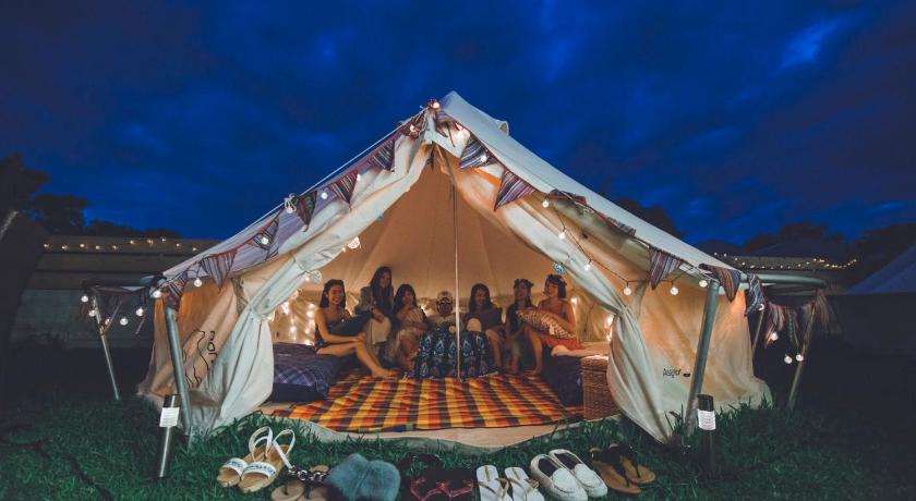 a tent is set up in a grassy area, Half Glamping Hoshioto in Okinawa Main island