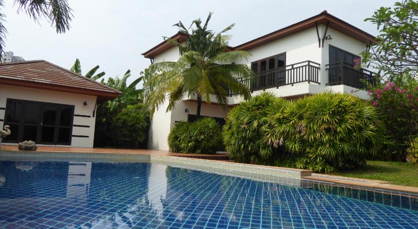 a pool with a pool table and a lawn chair in front of it, Tropicana Beach Villa at Vip Chain Resort in Rayong