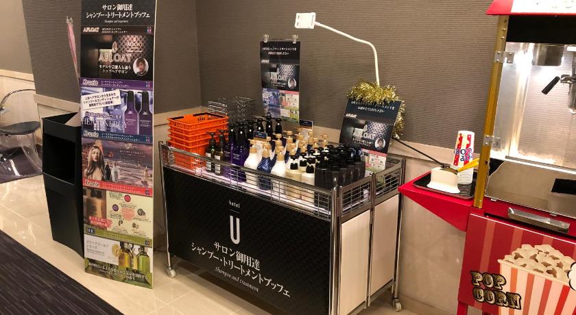 a bar with a lot of bottles of wine on it, Hotel U in Tokyo
