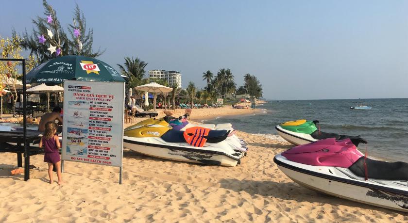 a beach with surfboards and a sign on the beach, Le Forest Resort in Phu Quoc Island