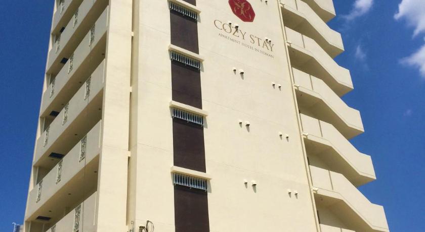 a large building with a clock on the front of it, Cozy Stay in Itoman in Okinawa Main island