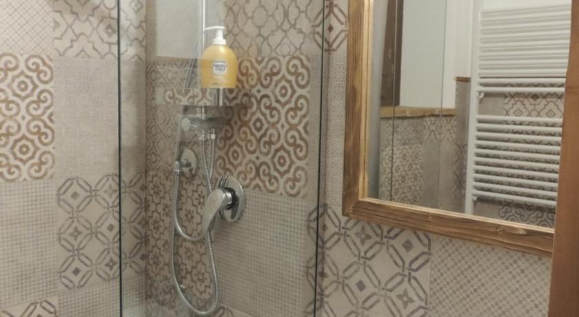 a bathroom with a shower, sink, and mirror, Picchio&Pinocchio in Sulmona