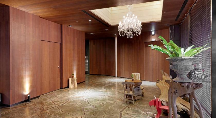 a living room filled with furniture and appliances, Inhouse Hotel Taichung in Taichung
