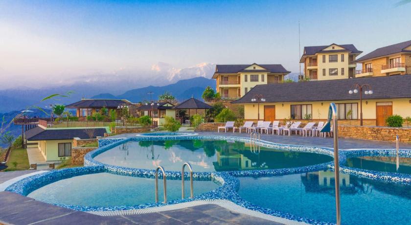 a hotel room with a pool and a swimming pool, Rupakot Resort in Pokhara
