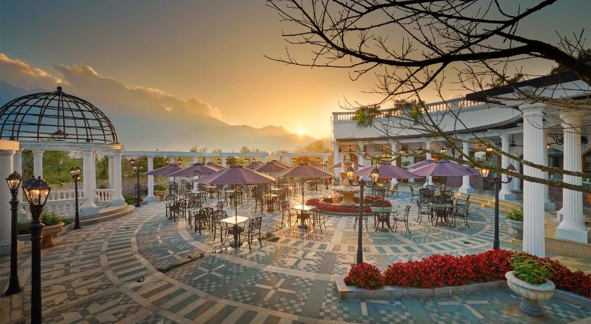a large building with many tables and umbrellas, Silk Path Grand Resort & Spa Sapa in Sapa