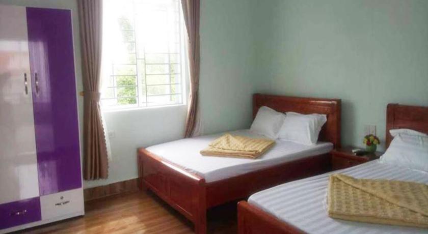 a bedroom with two beds and a window, Viet Anh 123 in Hạ Long