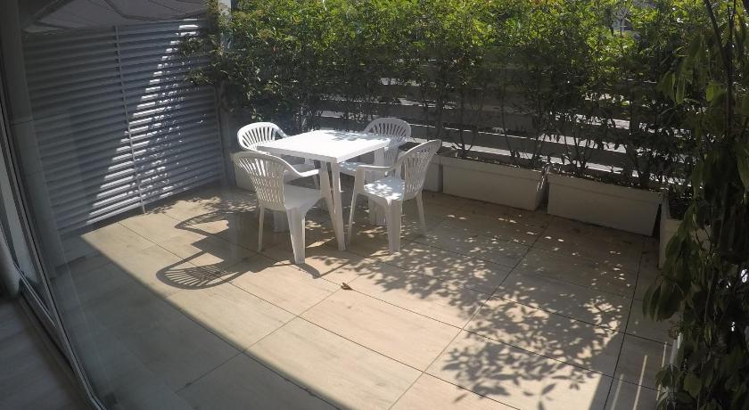 a table and chairs in front of a patio, New Mare Incanto in Caorle