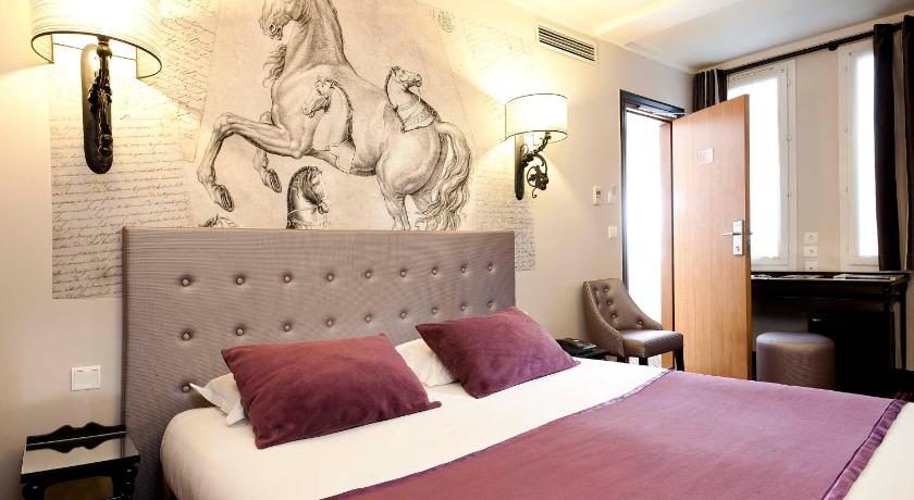 a hotel room with a large bed and a painting on the wall, Hotel Des Ducs D'Anjou in Paris