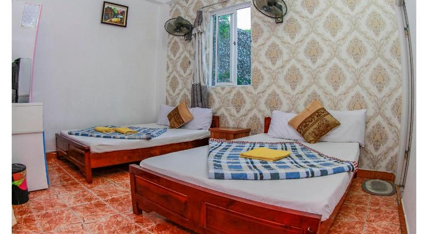 a hotel room with two beds and two lamps, Catba Hostel in Cat Ba Island
