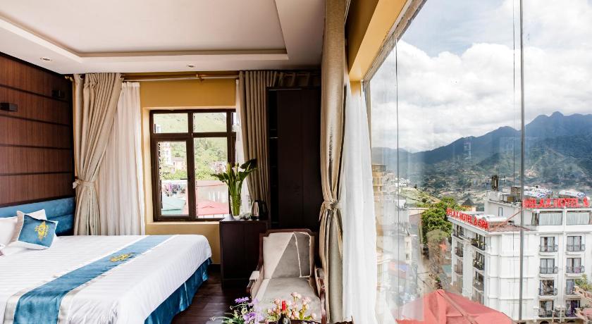a hotel room with a bed and a window, Sapa Mimosa Hotel in Sapa