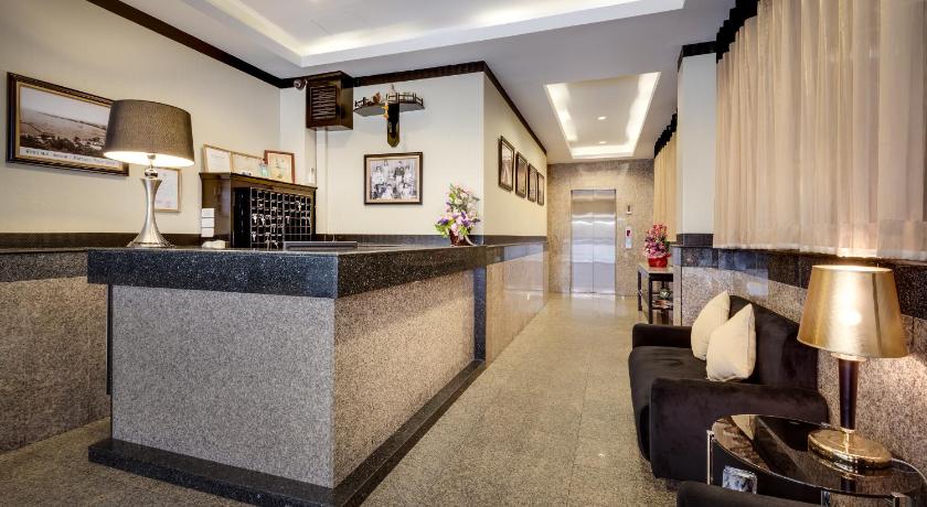 a large kitchen with a large counter top, Ambiance Pattaya Hotel in Pattaya