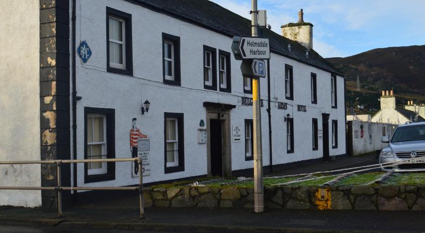 a white house on the corner of a street, Belgrave Arms Hotel in Helmsdale