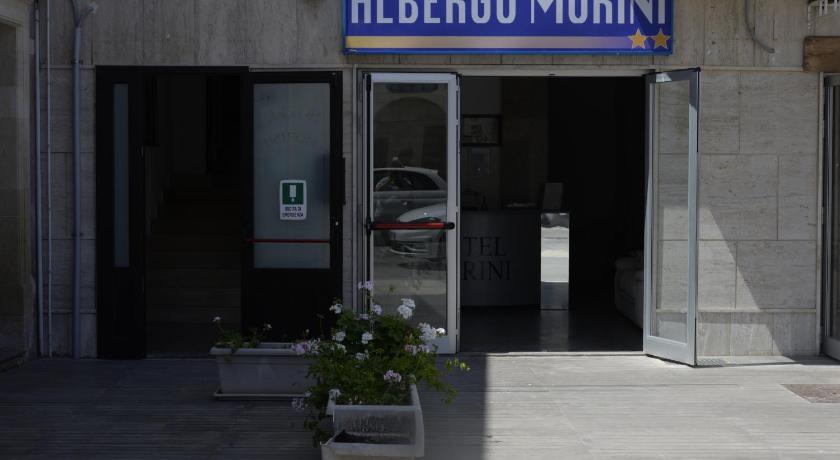 a parking meter in front of a building, Hotel Morini in Melendugno