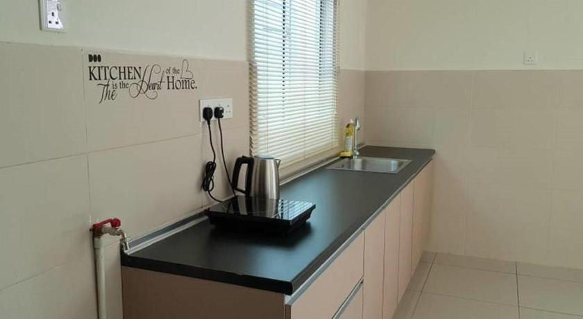a kitchen counter with a sink and a mirror, Greenlane98 @ 4 Room / 5 Bath / 23 Pax in Penang