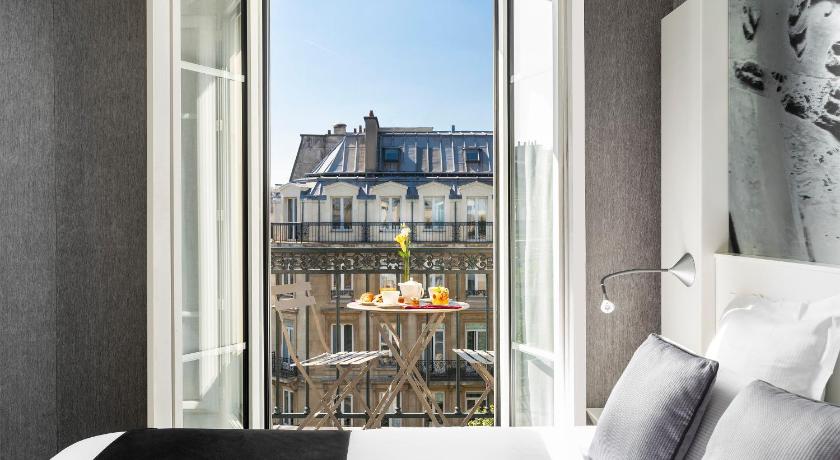 a window with a view of a city, Premier Marais Grands Boulevards in Paris