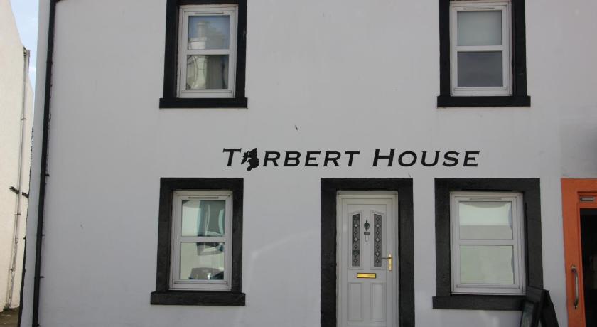 a white building with a sign on the side of it, Tarbert House in Bowmore