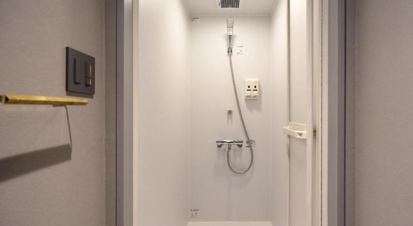 a bathroom with a sink, toilet, and shower stall, Resters Bed&Co. in Kumamoto