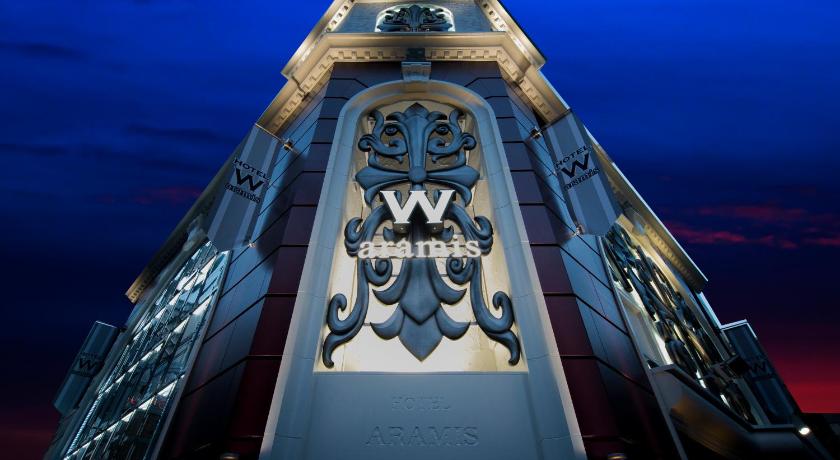 a large building with a clock on the top of it, Hotel W-ARAMIS -W GROUP HOTELS and RESORTS- in Tokyo