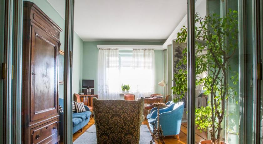 a living room filled with furniture and a window, Gianduja B&B in Turin