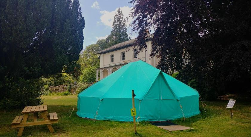 a green and white tent sitting in a grassy area, YHA Hawkshead in Ambleside
